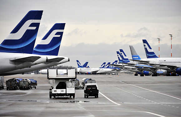 Passenger planes of Finnish national airline Finnair stand on the tarmac of Helsinki international airport in Finland.
