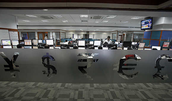 Foreign currency traders inside a firm in Mumbai.