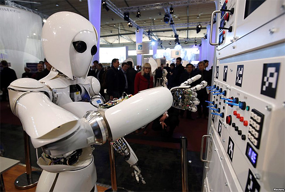 Humanoid robot AILA (artificial intelligence lightweight android) operates a switchboard during a demonstration by the German research centre for artificial intelligence at the CeBit computer fair in Hanover.