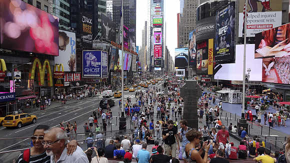 Tourists gather in Times Square in New York City.