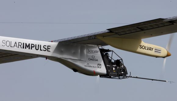 German test pilot Markus Scherdel steers the solar-powered Solar Impulse HB-SIA prototype airplane during his first flight over Payerne.