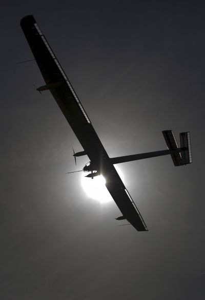German test pilot Markus Scherdel steers the solar-powered Solar Impulse HB-SIA prototype airplane during his first flight over Payerne