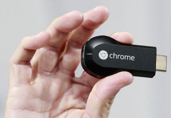 Mario Queiroz, vice president of product management, holds the new Google Chromecast dongle as it is announced during a Google event at Dogpatch Studio in San Francisco.