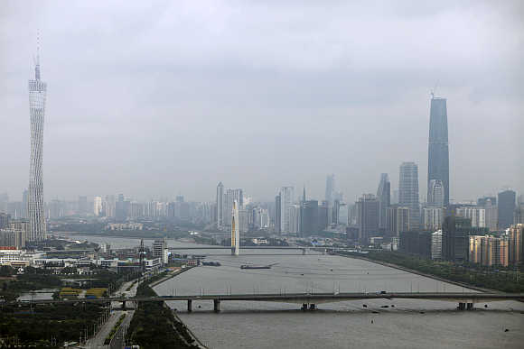 A view of 610-metre high Guangzhou TV & Sightseeing Tower, left, in Guangzhou.