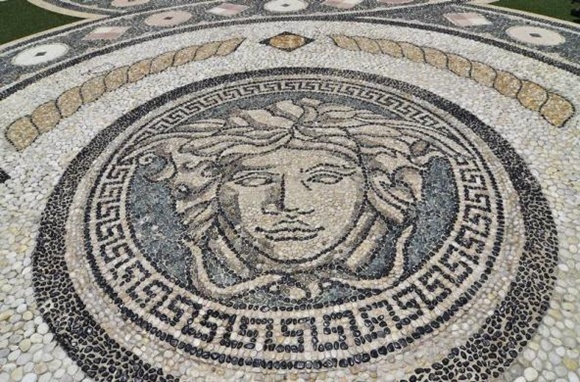 Mosaic on the the patio of the South Beach mansion.