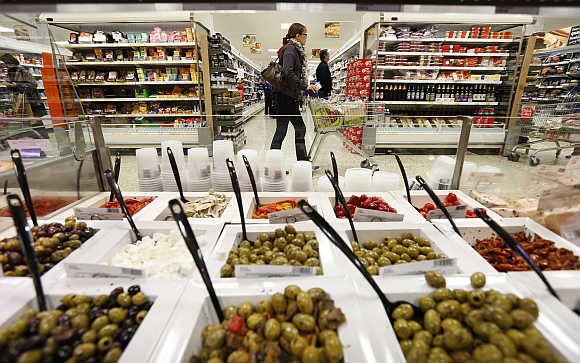 Customers shop at a Tesco store in Bishop's Stortford, southern England.