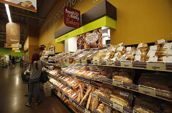 A shopper browses items along the bread aisle inside a Fresh & Easy store in Burbank, California.