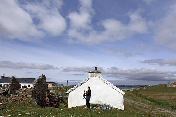Artist and poet Barry Edgar Pilcher, 69, plays the saxaphone on the Island of Inishfree in County Donegal. Pilcher is the only inhabitant of the island on which he has lived for the past 20 years. He only leaves the island once a week to collect his pension and buy groceries on the mainland.