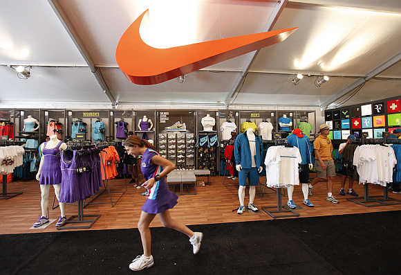 A ball girl runs past the Nike boutique at the Sony Ericsson Open tennis tournament in Key Biscayne, Florida. Nike is one of Global Experience Specialists's clients.