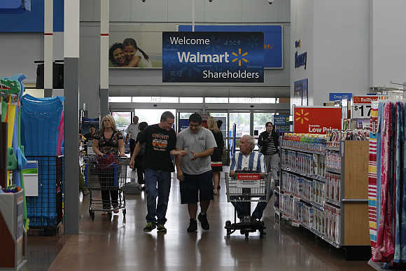 Customers shop at a Walmart Supercenter in Rogers, Arkansas. Walmart is one of Merkle's clients.
