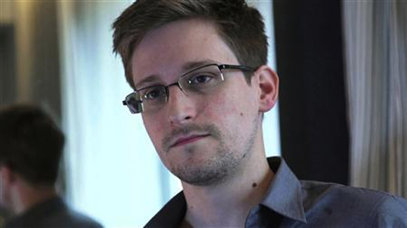 Former US spy agency contractor Edward Snowden is seen in this still image taken from video during an interview by The Guardian in his hotel room in Hong Kong.