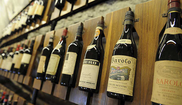 Bottles of Barolo wine are seen on a wall at the Barolo wine museum in Barolo, about 70km south of Turin, Italy.