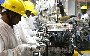 Employees work inside Maruti Suzuki's petrol engine plant on the outskirts of New Delhi. Photograph: Vijay Mathur/Reuters 