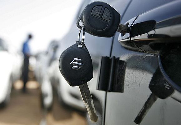 Keys hang from the door of a Maruti Suzuki Swift car at its stockyard on the outskirts of the western Indian city of Ahmedabad.