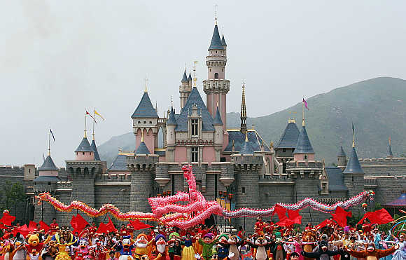 Disney characters perform in front of the Sleeping Beauty Castle in Hong Kong.