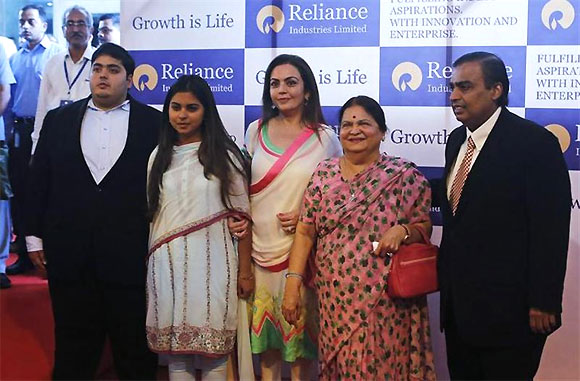 Mukesh Ambani (R), chairman of Reliance Industries Limited, poses with his son Akash, daughter Isha (2nd L), wife Nita (C) and mother Kokilaben, before addressing the annual shareholders meeting in Mumbai June 6, 2013.