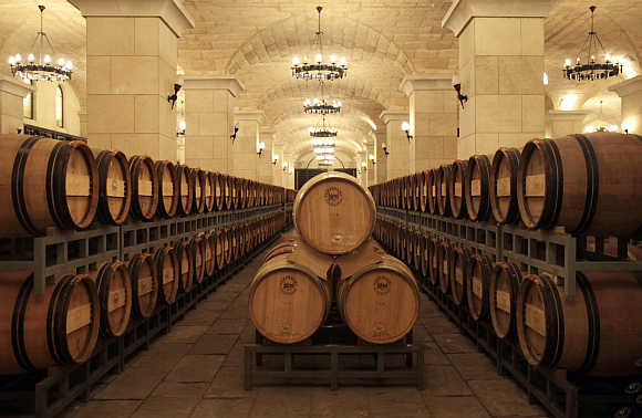 Barrels of wine are seen inside a cellar in Chateau Changyu Afip Global on the outskirts of Beijing.