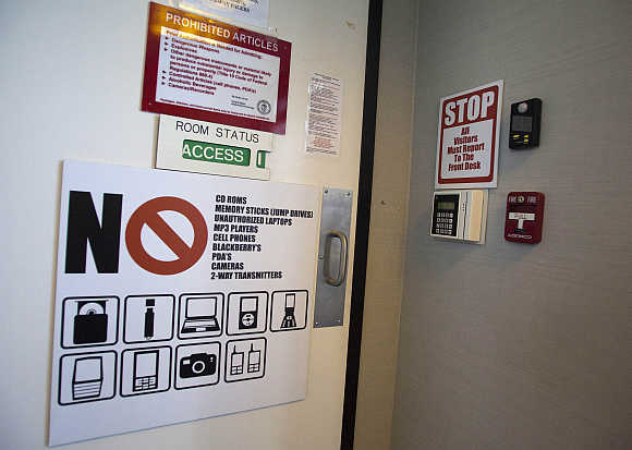 A sign lists prohibited items on a door leading to a watch and warning centre of a cyber security defence lab at the Idaho National Laboratory in Idaho Falls.