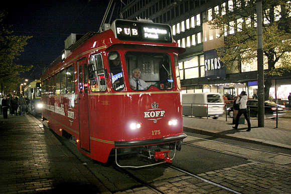 A tram which has been converted into a rolling pub combines sightseeing with a night on the town in Helsinki.