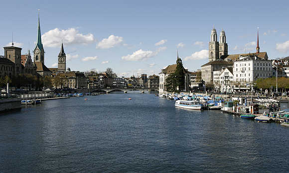 A view shows the city of Zurich and the Limmat River. On right is the Grossmuenster church.