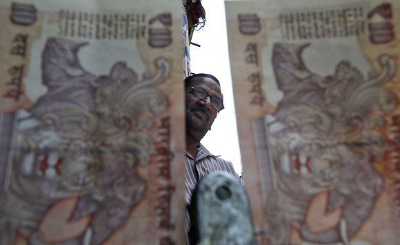 Rupee slide: Mixed bag for India Inc