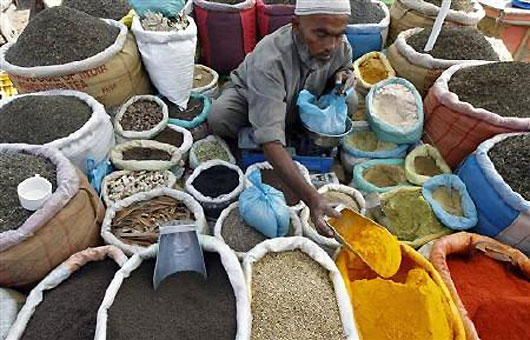 A vendor sells spices on a street in Srinagar.