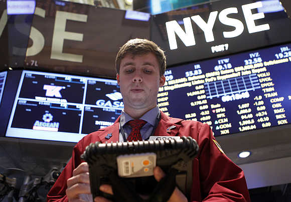 Trader Ryan O'Day works on the floor at the New York Stock Exchange.