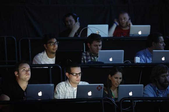 Writers use computers during the Sony news conference show on the eve of the opening of E3, the Electronic Entertainment Expo, in Los Angeles, California.