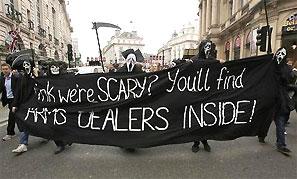 Demonstrators protesting against the upcoming G8 summit, being held near Enniskillen, Northern Ireland, hold a banner as they walk to BAE systems headquarters in central London, June 12, 2013. Photograph: Olivia Harris/Reuters