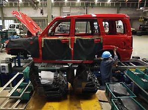 A mechanic works at a Mahindra & Mahindra car factory in Nashik. Photograph: Adeel Halim/Reuters