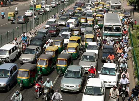 Traffic moves at a slow pace in New Delhi.