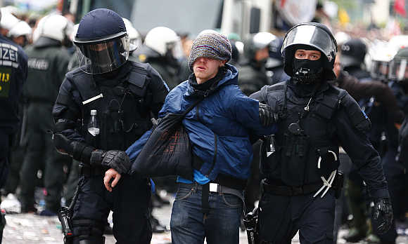 German police detain a protester during an anti-capitalism demonstration in Frankfurt.