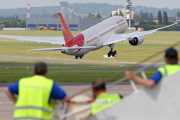An Air India Airlines Boeing 787 Dreamliner takes off for a flying display during the 50th Paris Air Show at the Le Bourget airport near Paris.