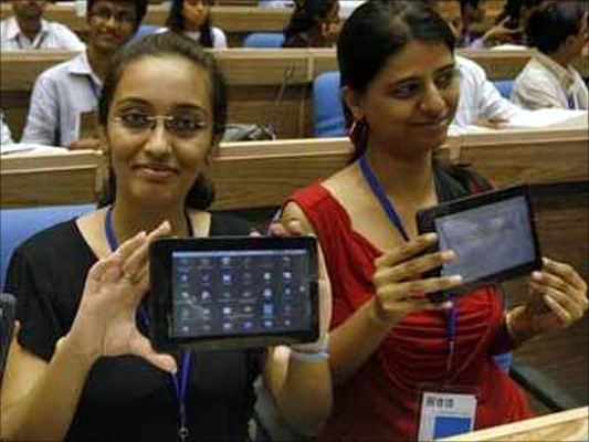 A student with a Aakash Tablet.