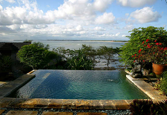 A private pool looks out over Jimbaran Bay from a villa in Bali.