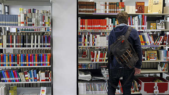A man looks at books in Goethe Institute's library in Barcelona, Spain.