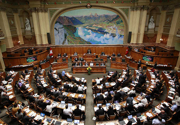 A view shows the members of the National Council during the parliament session in Bern, Switzerland.