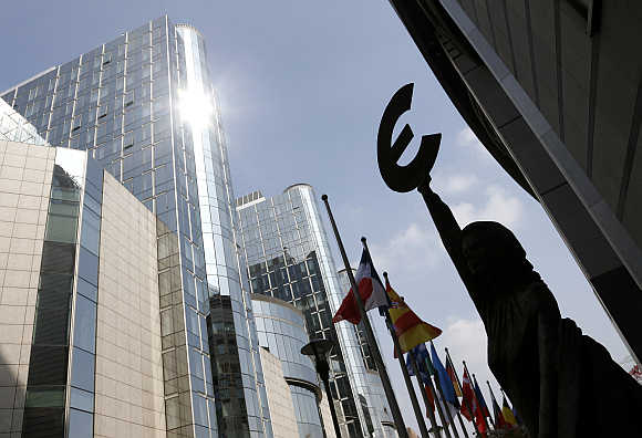 A statue depicting European unity is seen outside the European Parliament in Brussels, Belgium.