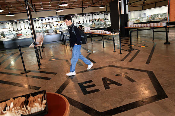 An employee walks through the cafeteria at the headquarters of Facebook in Menlo Park, California.