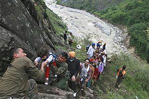 Soldiers rescue stranded tourists in Uttarakhand. Photograph: Reuters