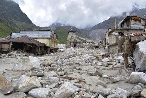 The Kedarnath Temple (C) is pictured amid damaged surroundings.