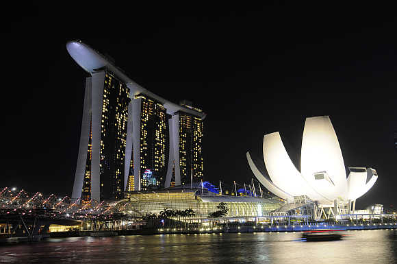 Marina Bay Sands hotel, left, and ArtScience Museum, right, in Singapore.
