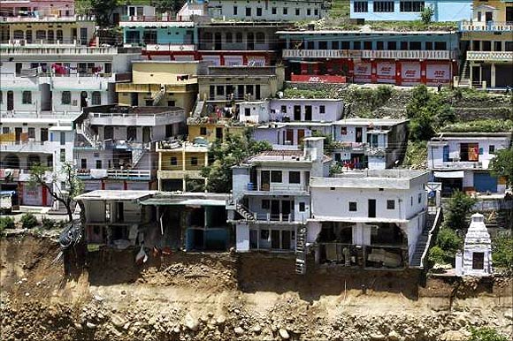Damaged houses are seen at a village in Rudraprayag in Uttarakhand.