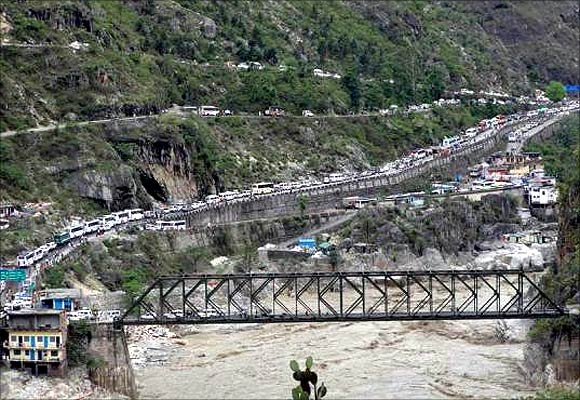 Stranded vehicles stand in queues after heavy rains in Uttarakhand.