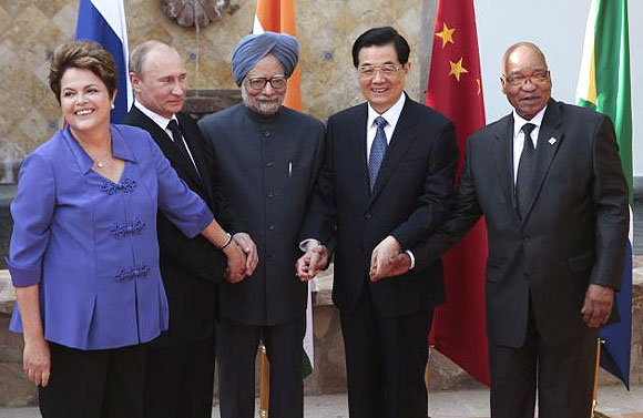 Brazilian president Dilma Rousseff, Russian president Vladimir Putin, Indian Prime Minister Manmohan Singh, then-Chinese president Hu Jintao, and South African president Jacob Zuma meet at a G20 summit in Los Cabos, Mexico June 18, 2012.