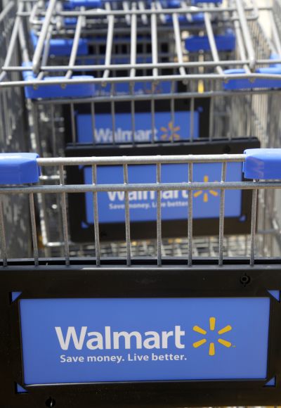 Shopping carts are seen outside a new Walmart Express store.