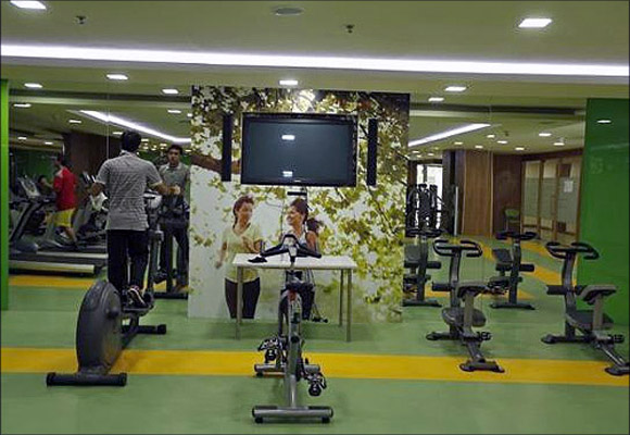 Employees work out at a gym inside Tech Mahindra office building in Noida on the outskirts of New Delhi. 