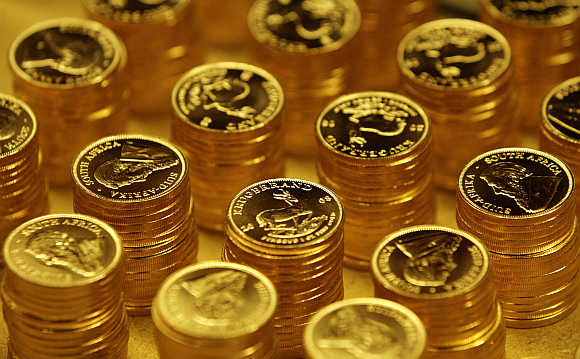 Gold bullion coins in the mint where they are manufactured in Midrand outside Johannesburg, South Africa.