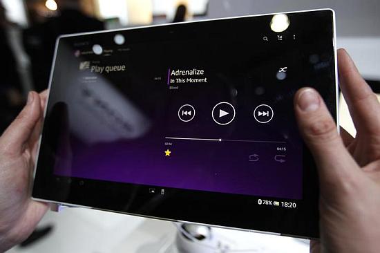 A visitor holds the new Sony Xperia Z Tablet during the Mobile World Congress in Barcelona.