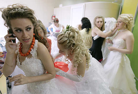 Women in bridal gowns take part in a carnival for newly wed brides in Russia's southern city of Stavropol.